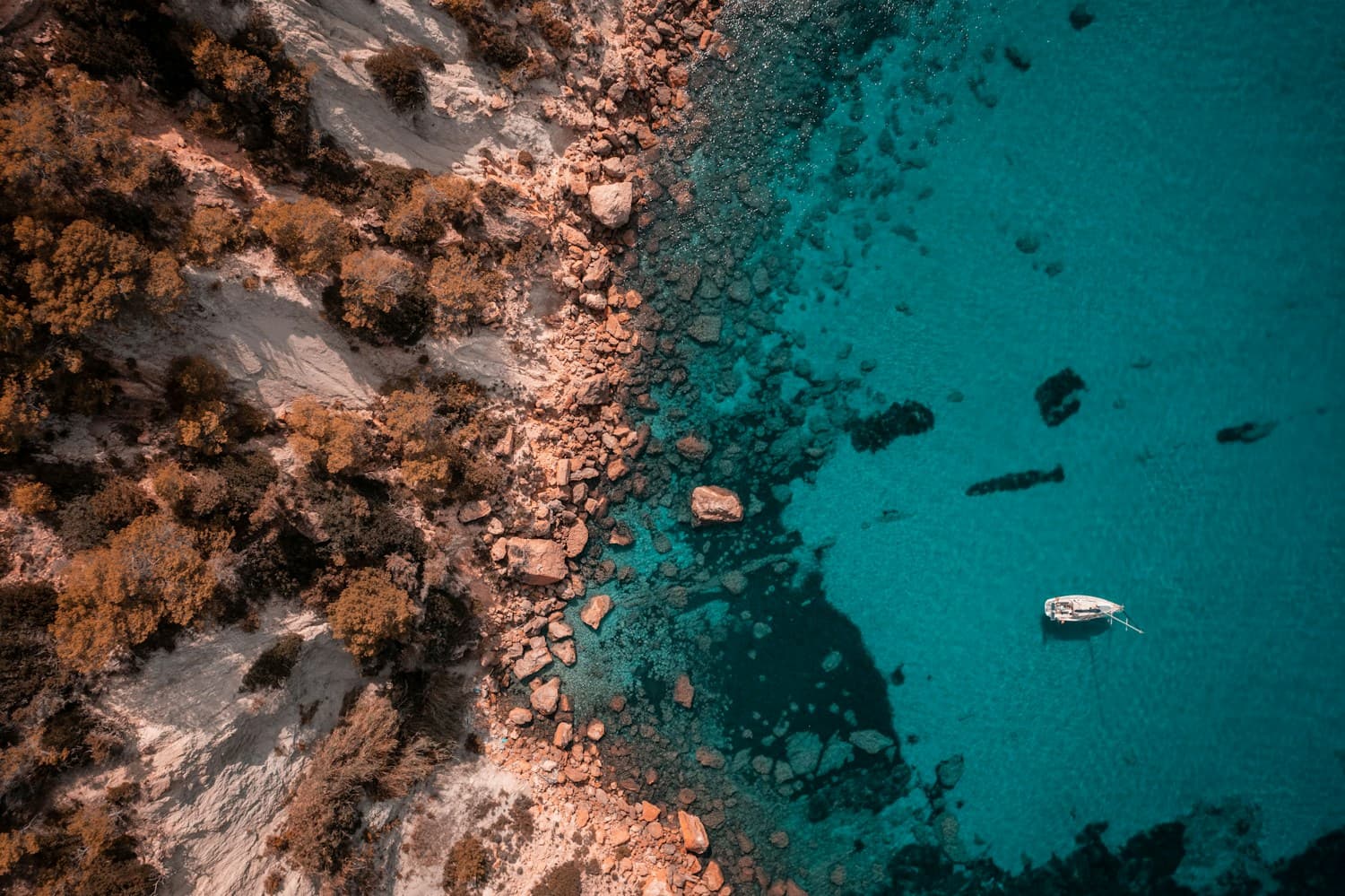 A quiet anchorage beside the rocky coast of Ibiza